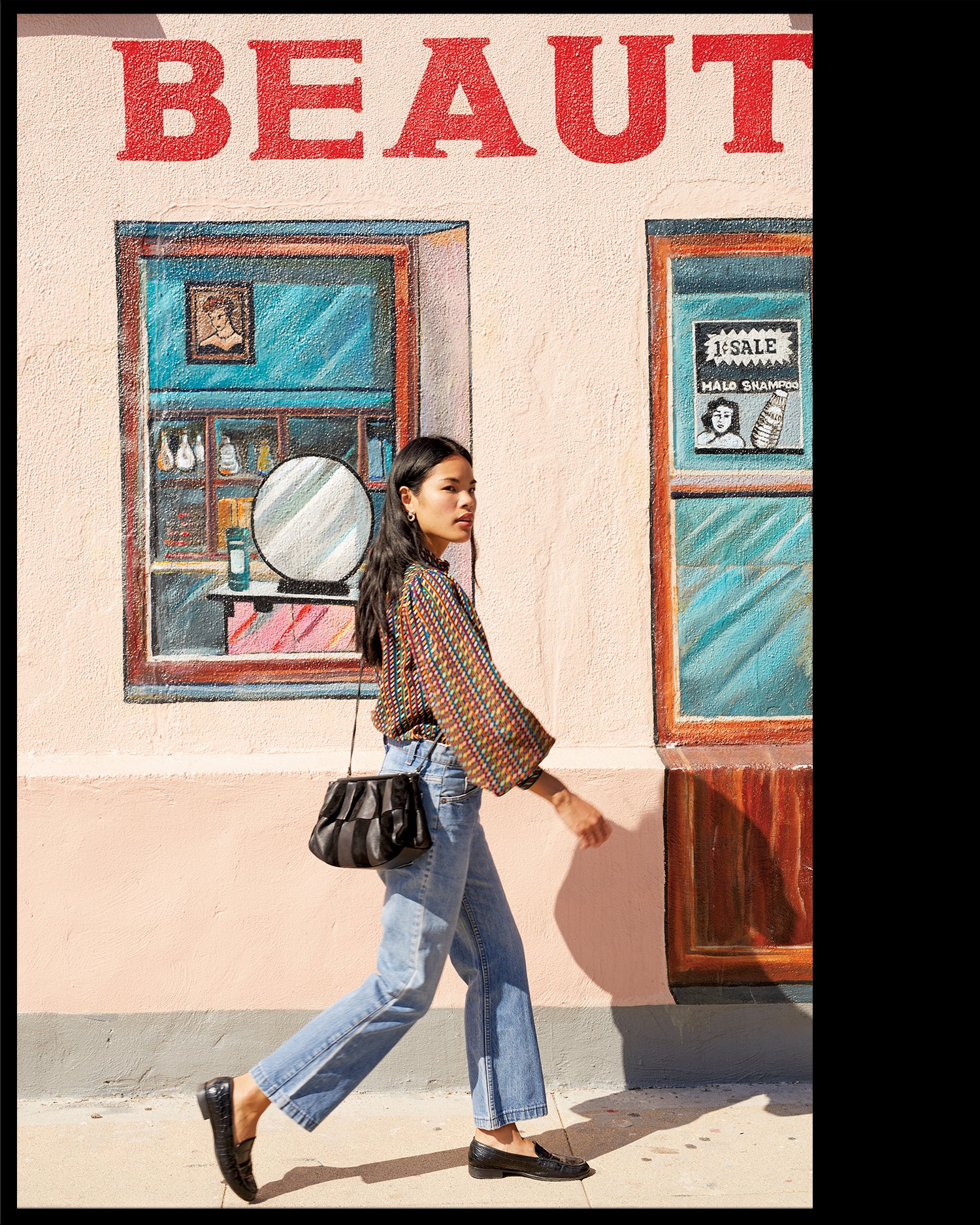 Sandra carrying the Black Suede and Nappa Belle as a crossbody bag.