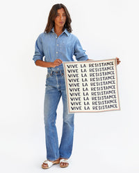 Hayley holds the Vive La Resistance Bandana Unfolded with Both Hands