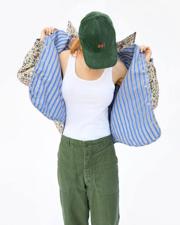 haley wearing the Forest Corduroy Oui Baseball Hat with army pants and a white tank