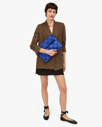 Nike holding Carryall Clutch full view