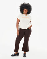 Candice wearing the Cream Discothèque classic tee with the chocolate le flair pants
