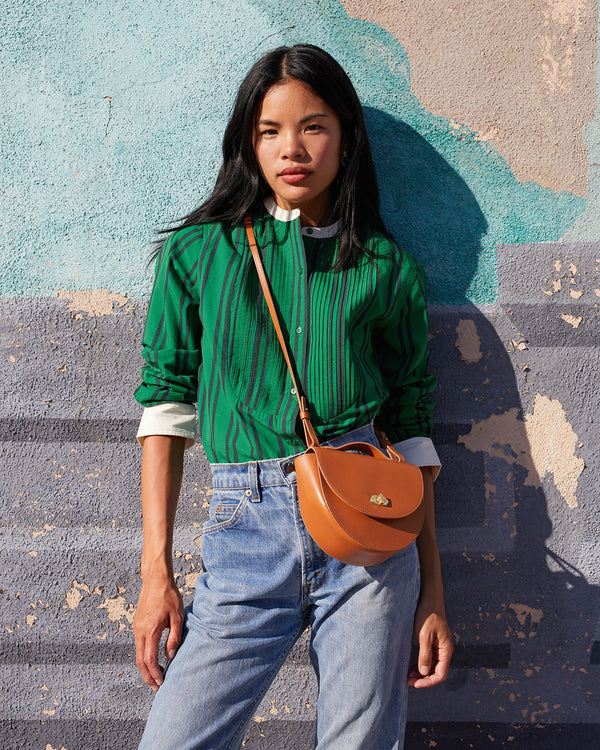 Sandra wearing the Cuoio Elodie crossbody over the Tux Shirt