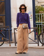 Gabrielle wearing the Sea Urchin Elsa Sweater tucked in to tan slacks