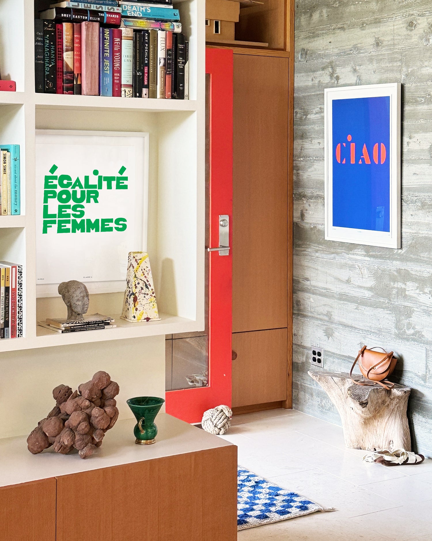 Room with two Clare V. x Framebridge Prints on the wall - one that says Ègalité Pour Les Femmes and another that reads Ciao