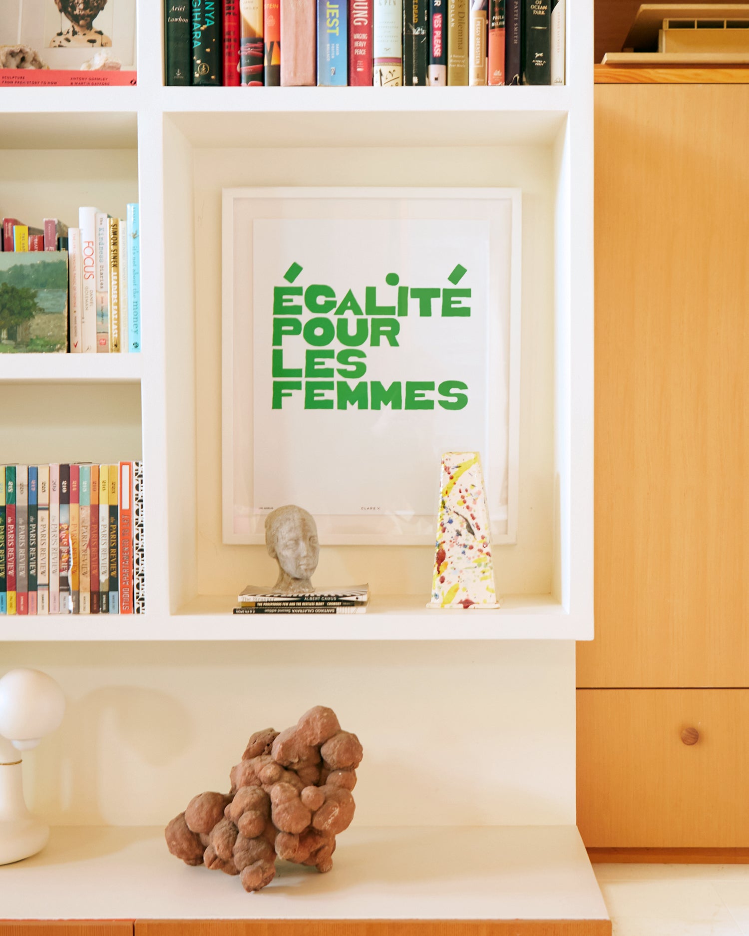 Clare V. x Framebridge Ègalité Pour Les Femmes print in a room cubby.