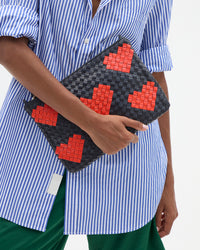 Flat Clutch in Vitoria's hand