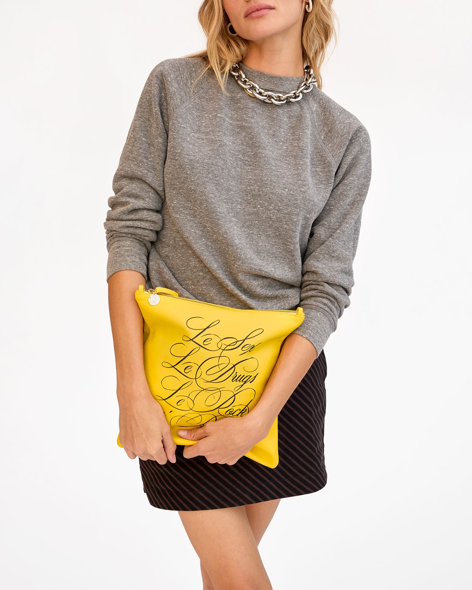 Mae holding Foldover Clutch w Tabs
