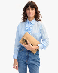 Danica holding Foldover Clutch w Tabs