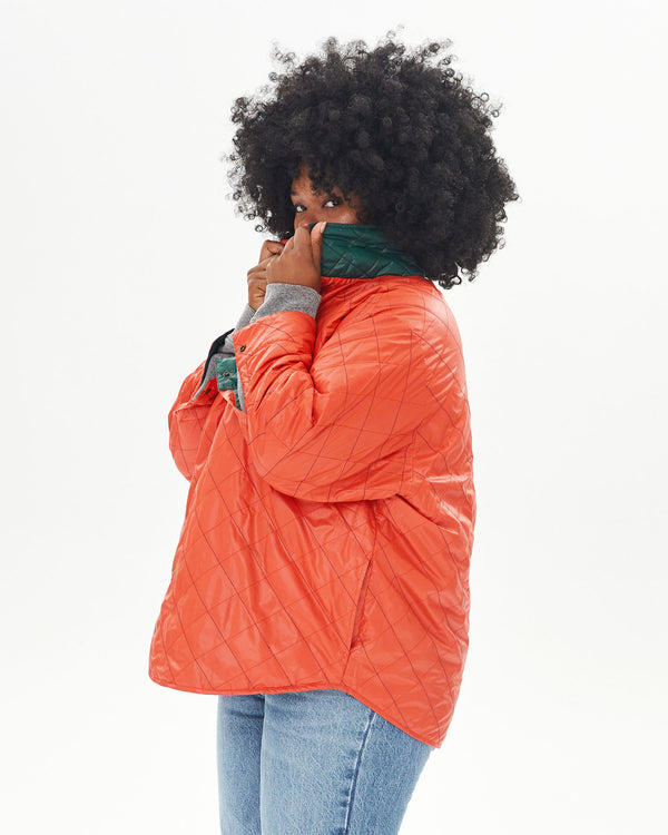 Candice hiding her face with the collar of the Spruce & Poppy Quilted Nylon Jacque Jacket