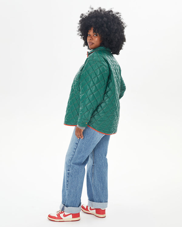 Candice facing away from the camera wearing the Spruce & Poppy Quilted Nylon Jacque Jacket