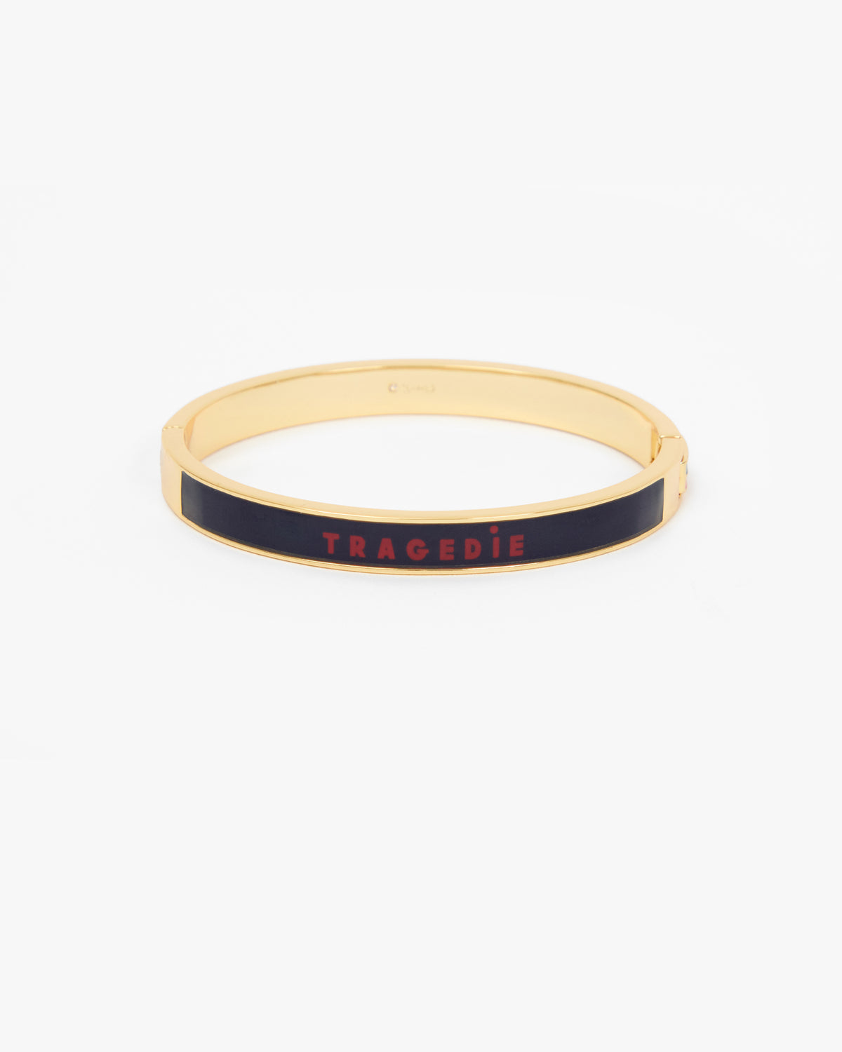 Le Bangle Bracelet featuring a black enamel inlay with the word 'TRAGEDIE' in red lettering.