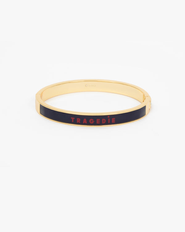 Le Bangle Bracelet featuring a black enamel inlay with the word 'TRAGEDIE' in red lettering.