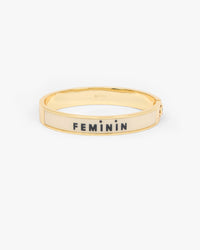 Le Bangle Bracelet showing the other side of the bracelet that reads "FEMININ". 