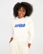 mecca wearing the Cream Apéro Le drop with white slacks