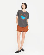 athena wearing the original tee faded black with bright poppy st calais blue maison bourgneuf with a rust colored skort