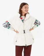 Zoe wearing the Pryenex Diana Vest in Milk over the CV Icon Sweater
