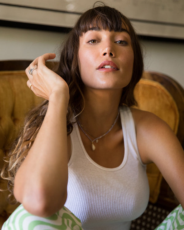 Model wearing the Rel Beauty Lip Balm in For Sure