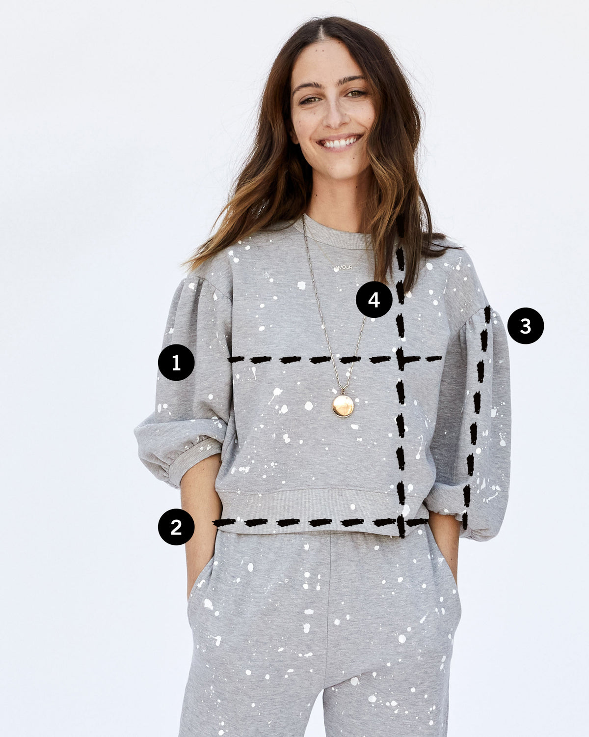 image of Frannie in a grey sweatshirt with 4 lines depicting where the user should measure for their bust, sweep, sleeve and length measurements in comparison to the garment