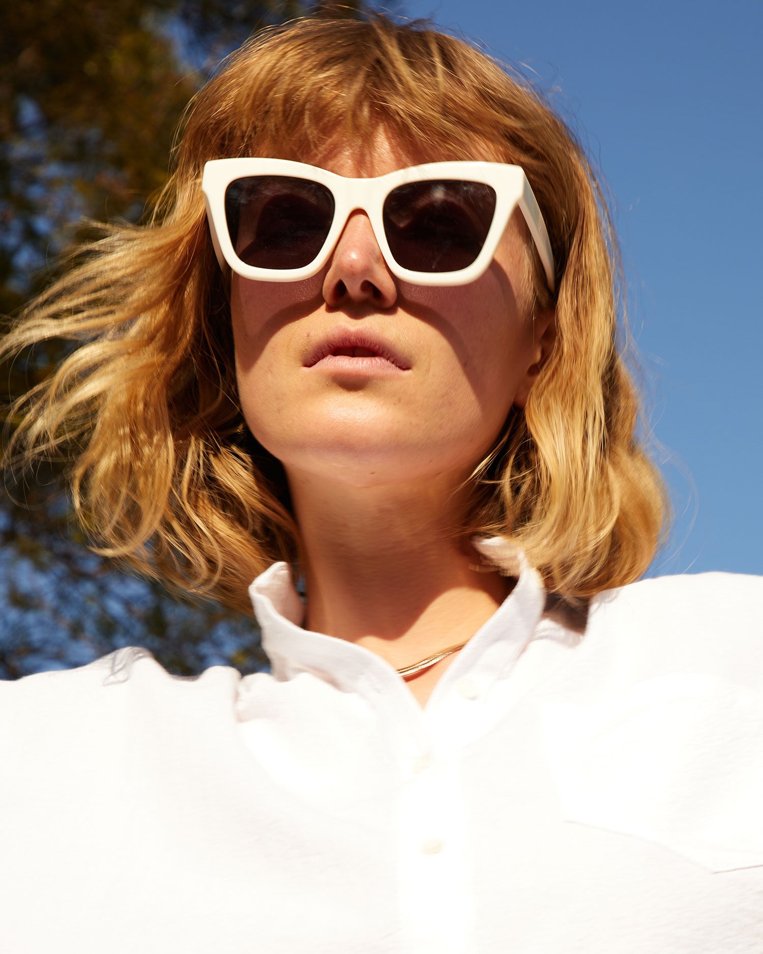 Lou wearing our White Heather Sunglasses.