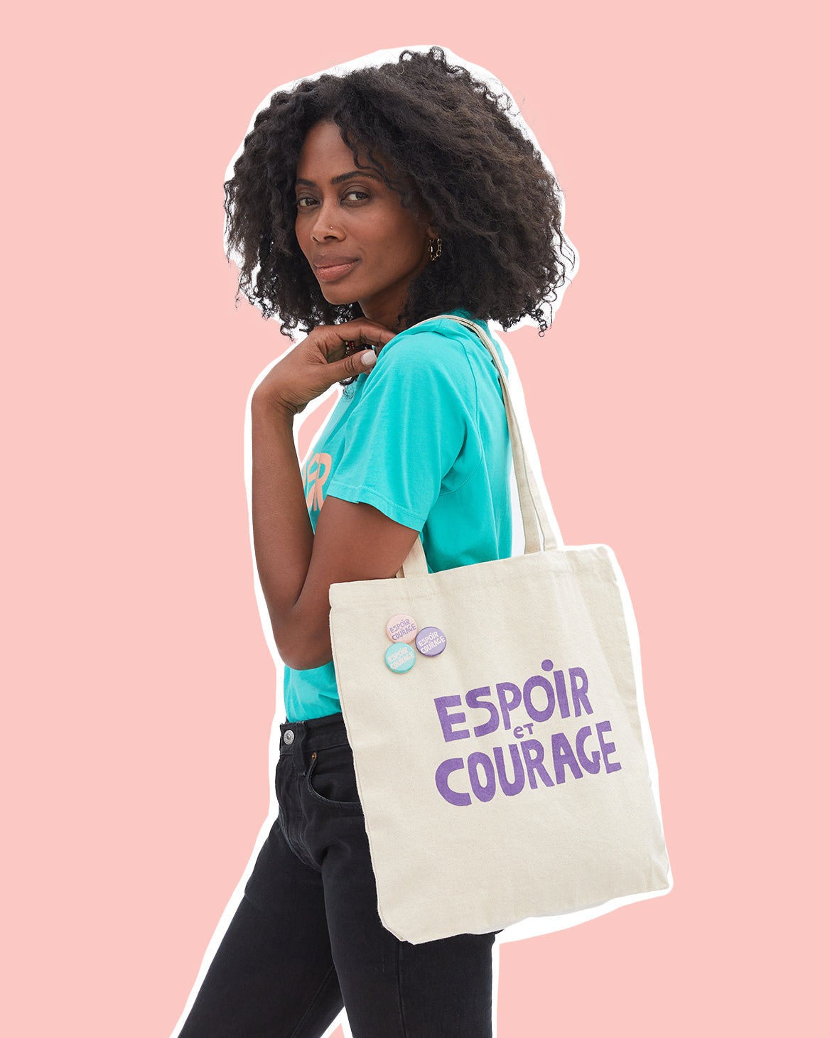 Mecca Wearing Our CV x Giffords Turquoise Tee Shirt and CV x Giffords Canvas Tote with Pins Over Her Shoulder.
