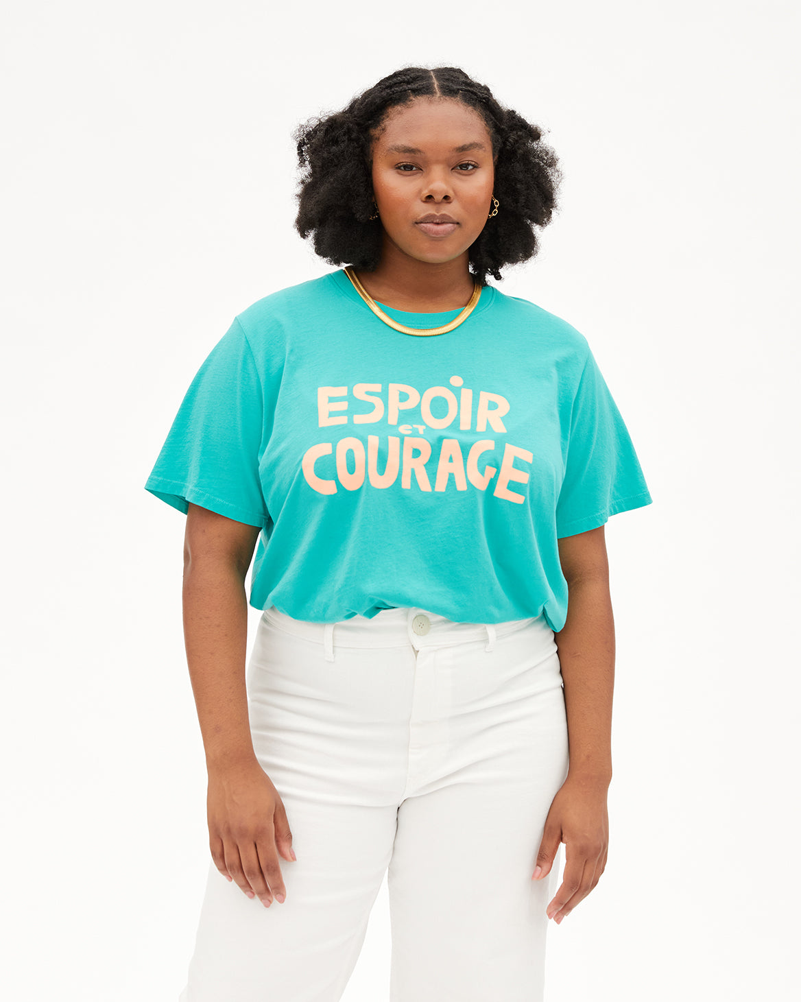 Candice wearing our CV x Giffords Espoir Et Courage Turquoise Tee with with High Rise Denim Jeans.