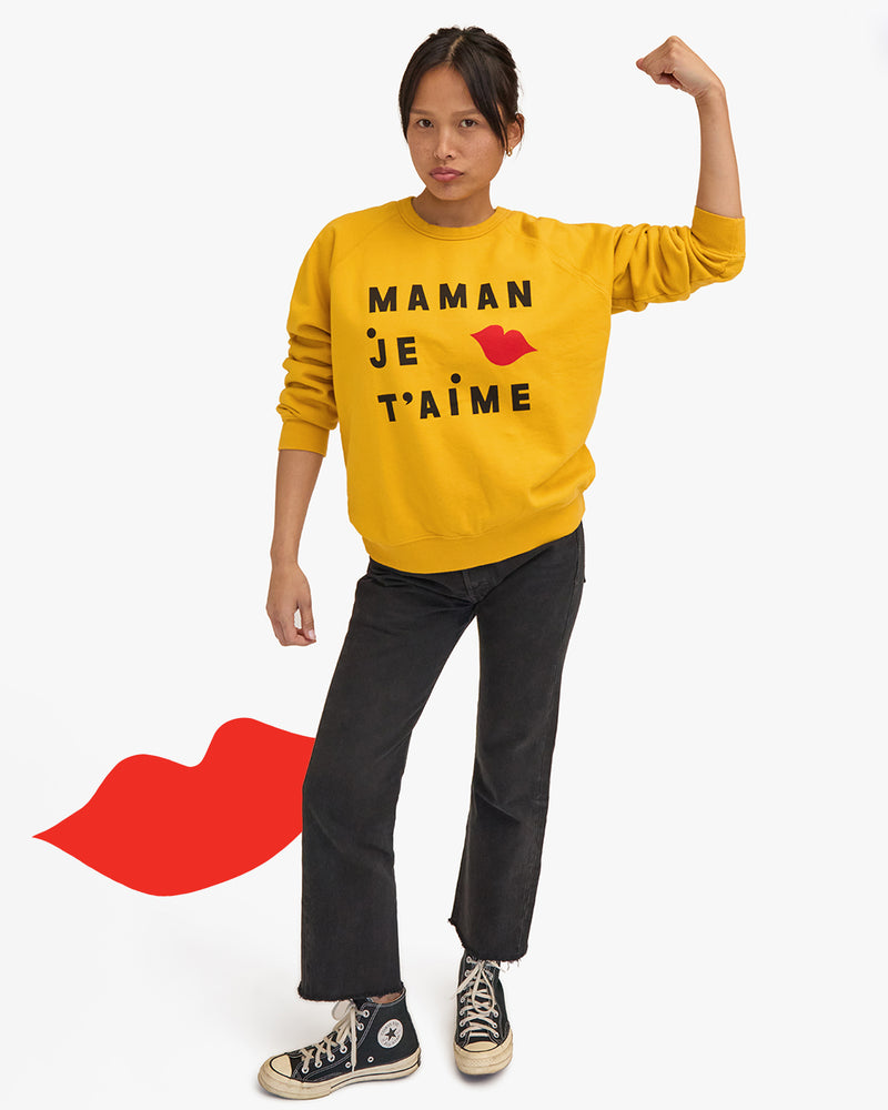 Model wearing the Marigold Maman Je T'aime EMC Sweatshirt with black jeans. 