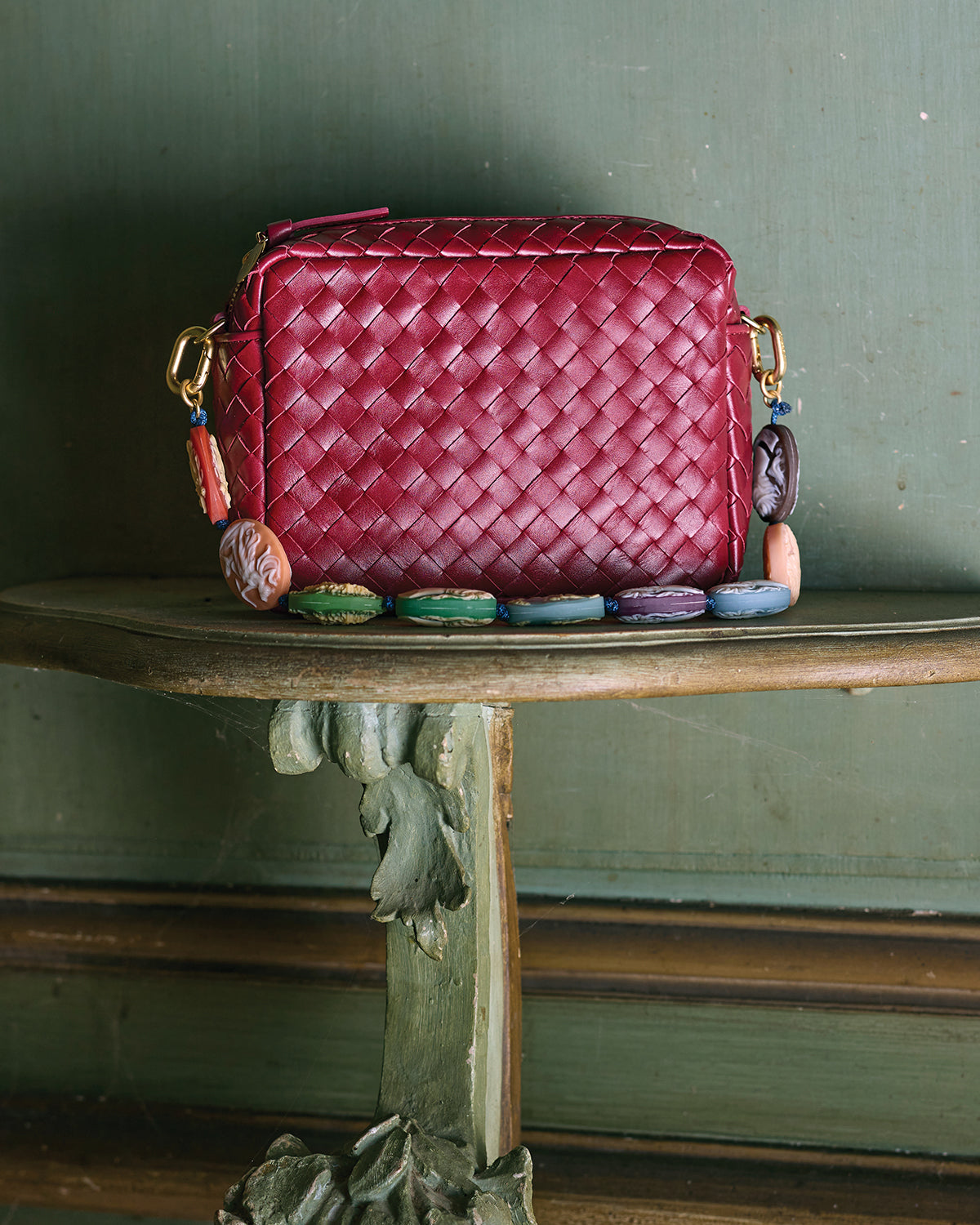 Garnet Diagonal Woven Midi Sac with Pocket with Multi Cameo Shortie Strap attached to it. 