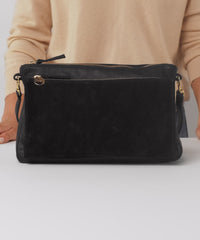 Model shows what fits in the Black Gosee Clutch