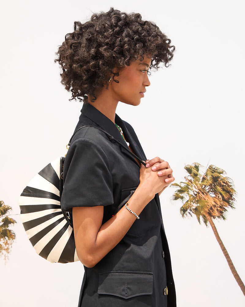 Model carrying Lune on her shoulder. 