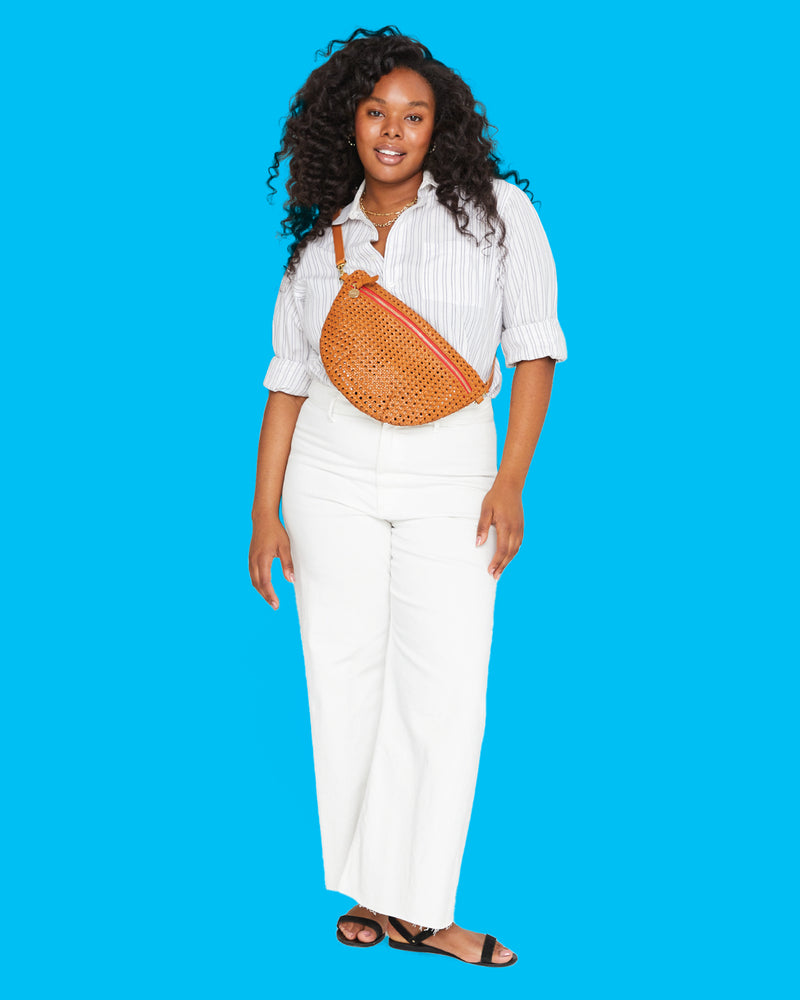 Candice wearing the Tan Rattan Grande Fanny across her chest.