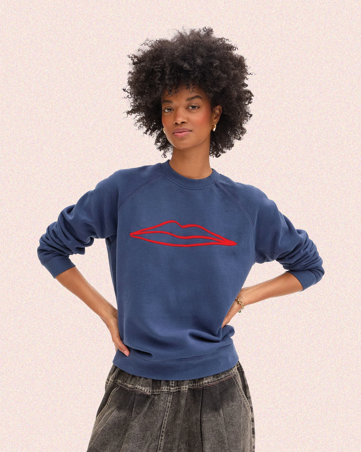 Model wearing the Navy with Surrealisme  Lips Sweatshirt. 