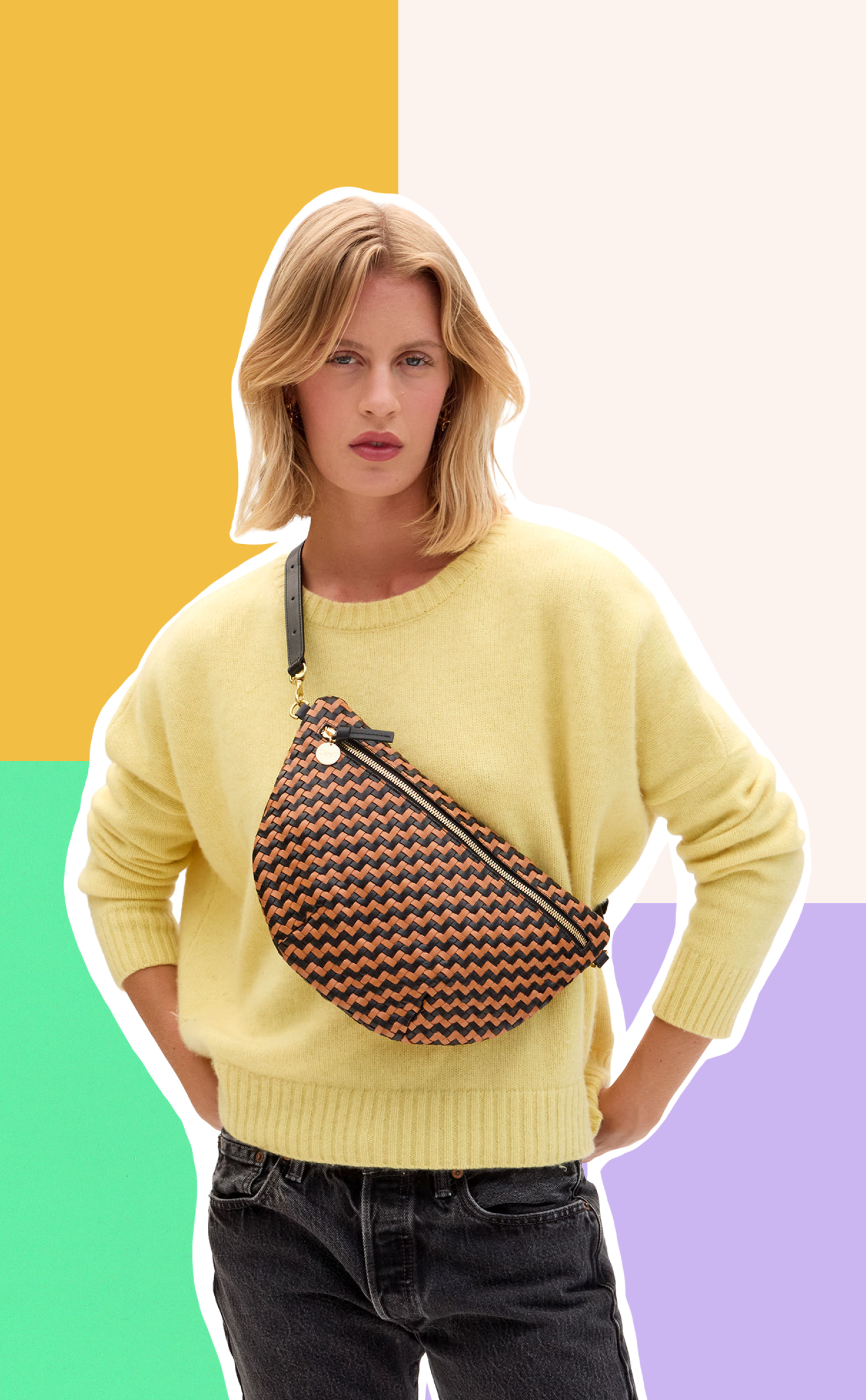 Model carrying the Black and Natural Woven Zig Zag Grande Fanny across her chest. 