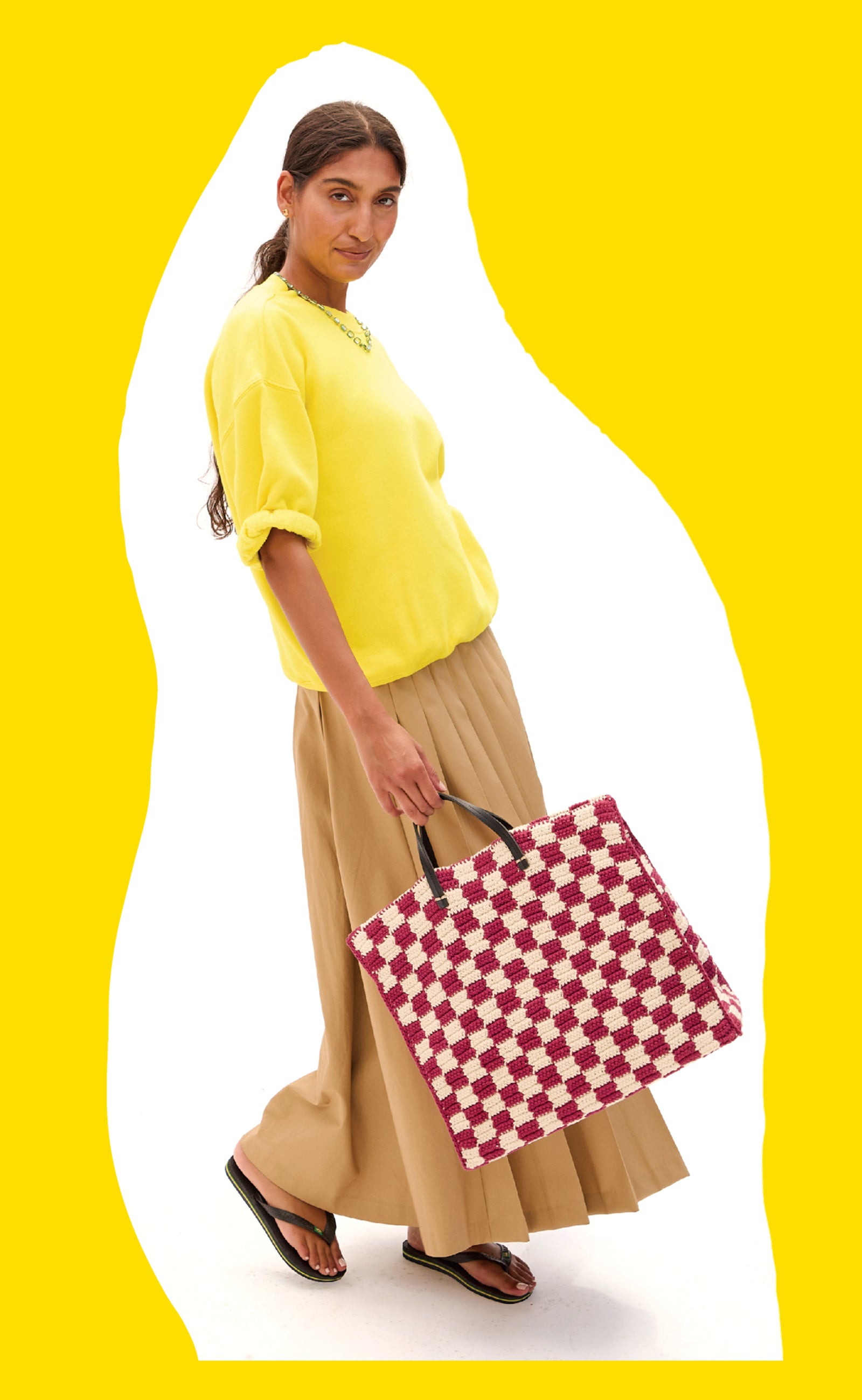 Model wearing the Citron Short Sleeve Oversized Sweatshirt and carrying the Plummy and Cream Summer Simple Tote. 
