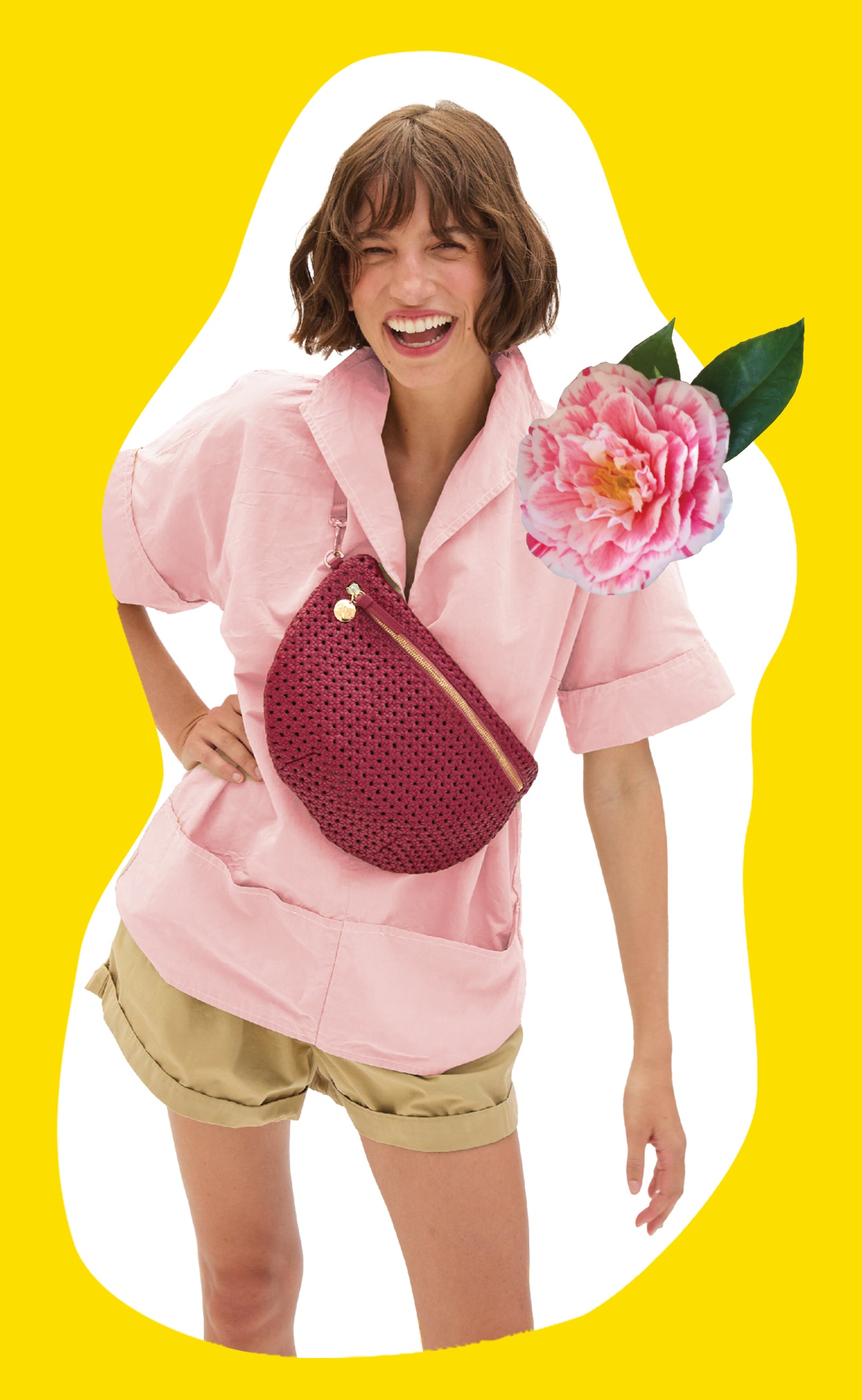 Model carrying the Plummy Rattan Grande Fanny across her chest. 