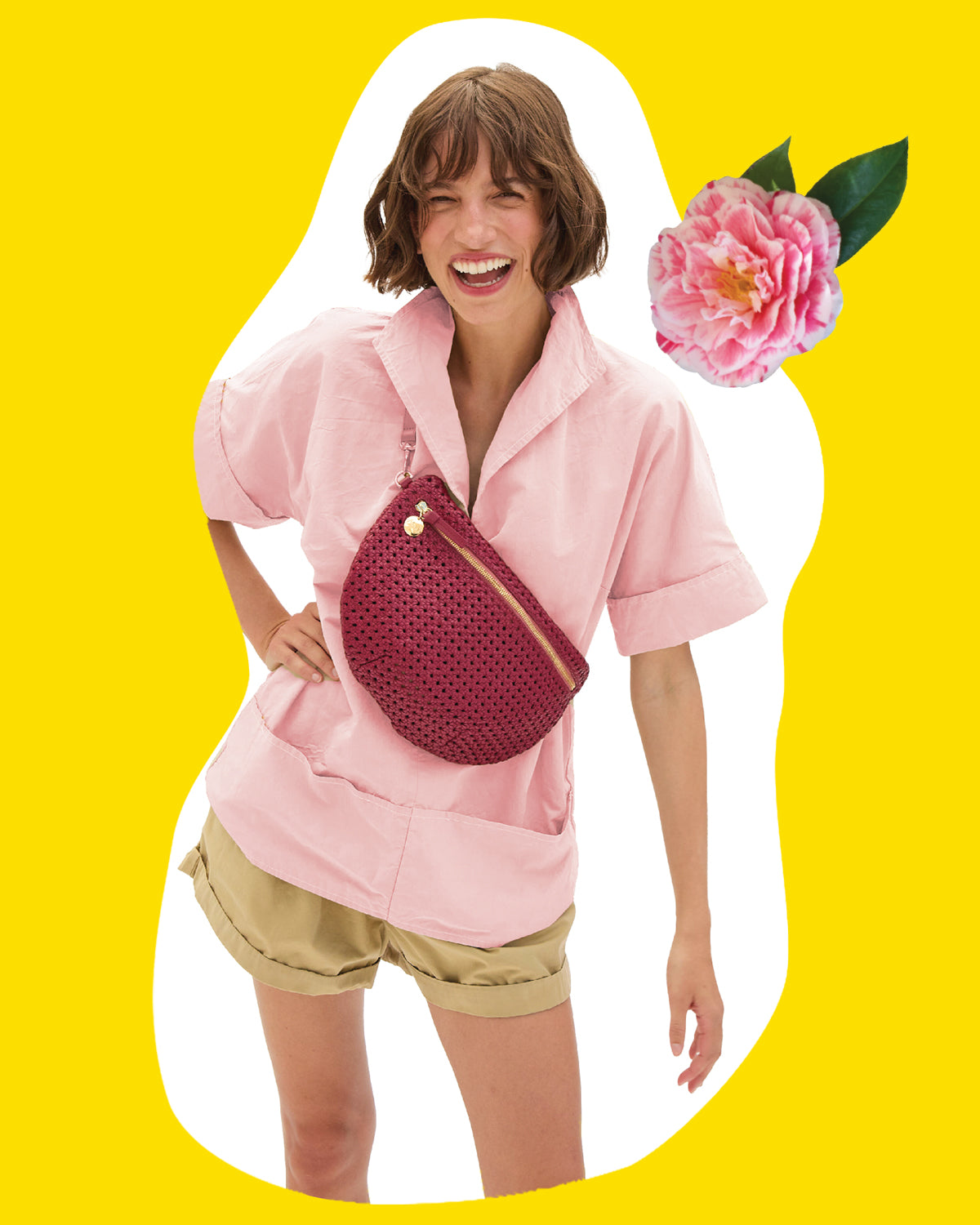 Model carrying the Plummy Rattan Grande Fanny across her chest. 
