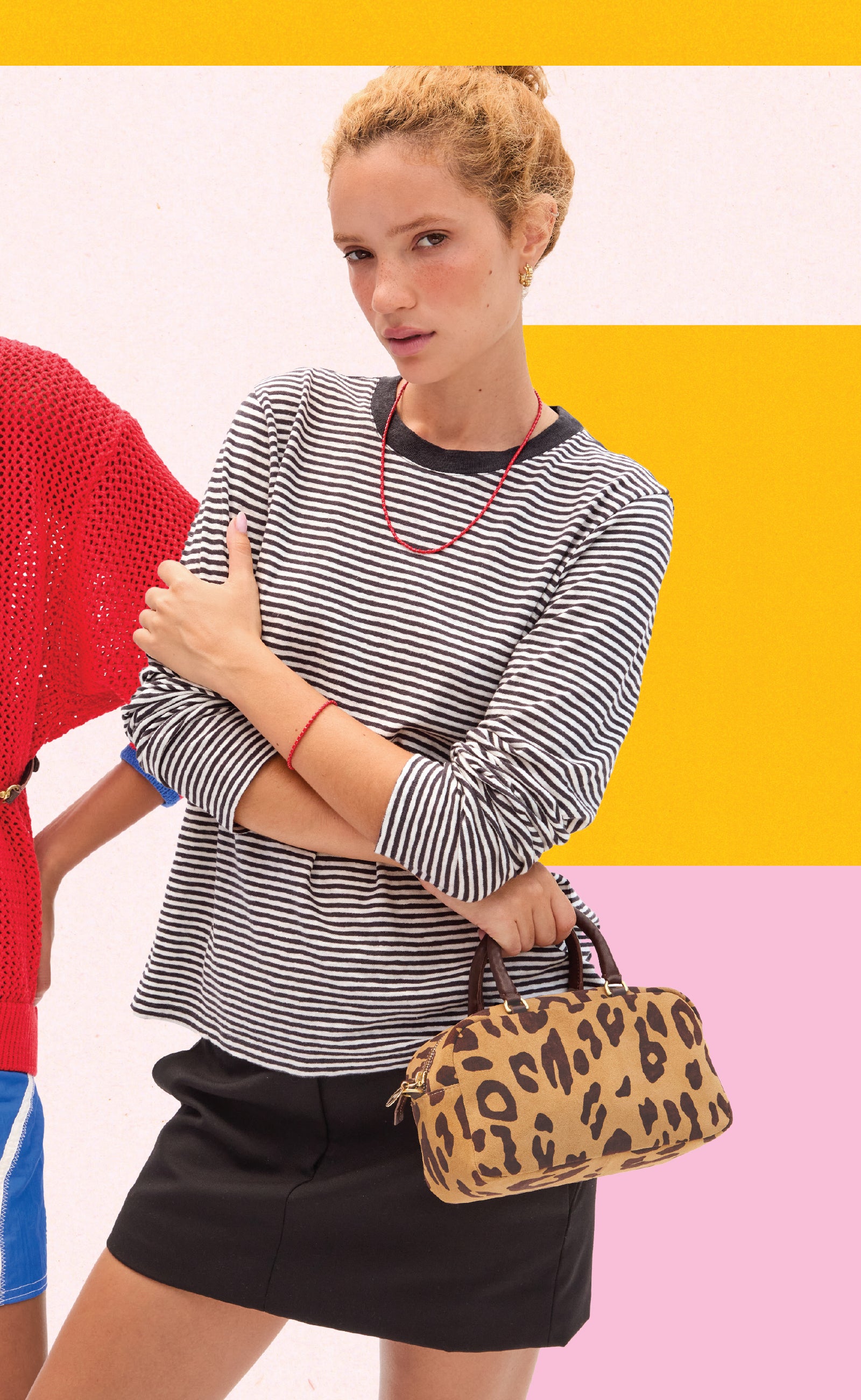 Model wearing the Black and Cream Mini Stripe Long Sleeve Tee and carrying the Pablo Cat Petite Claudine.