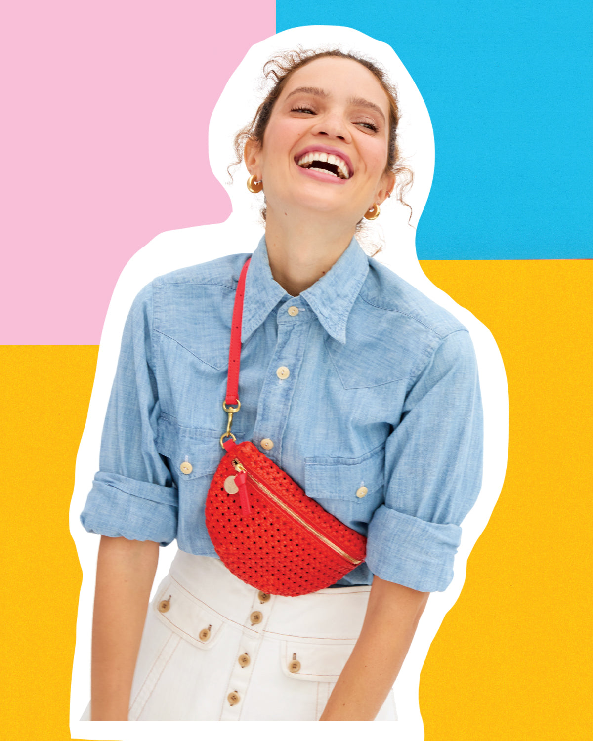 Model carrying the Bright Poppy Rattan Petit Fanny across her chest. 