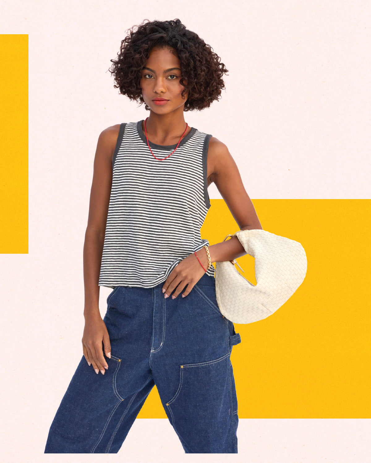 Moel holding the Cream Petit Moyen with Gold Top Handle Bébé.