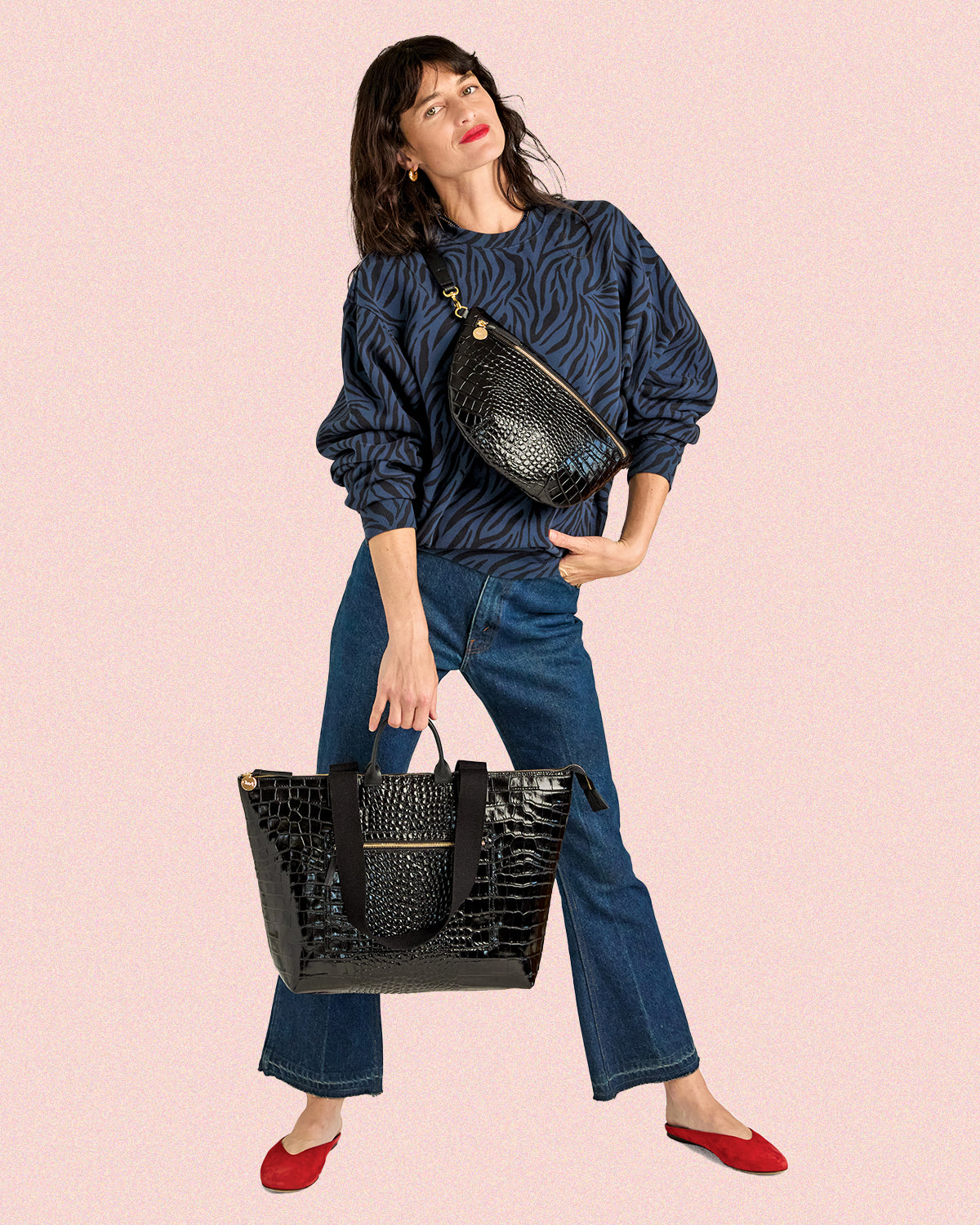 Model carrying the Black Croco Le Zip Sac and Grande Fanny.