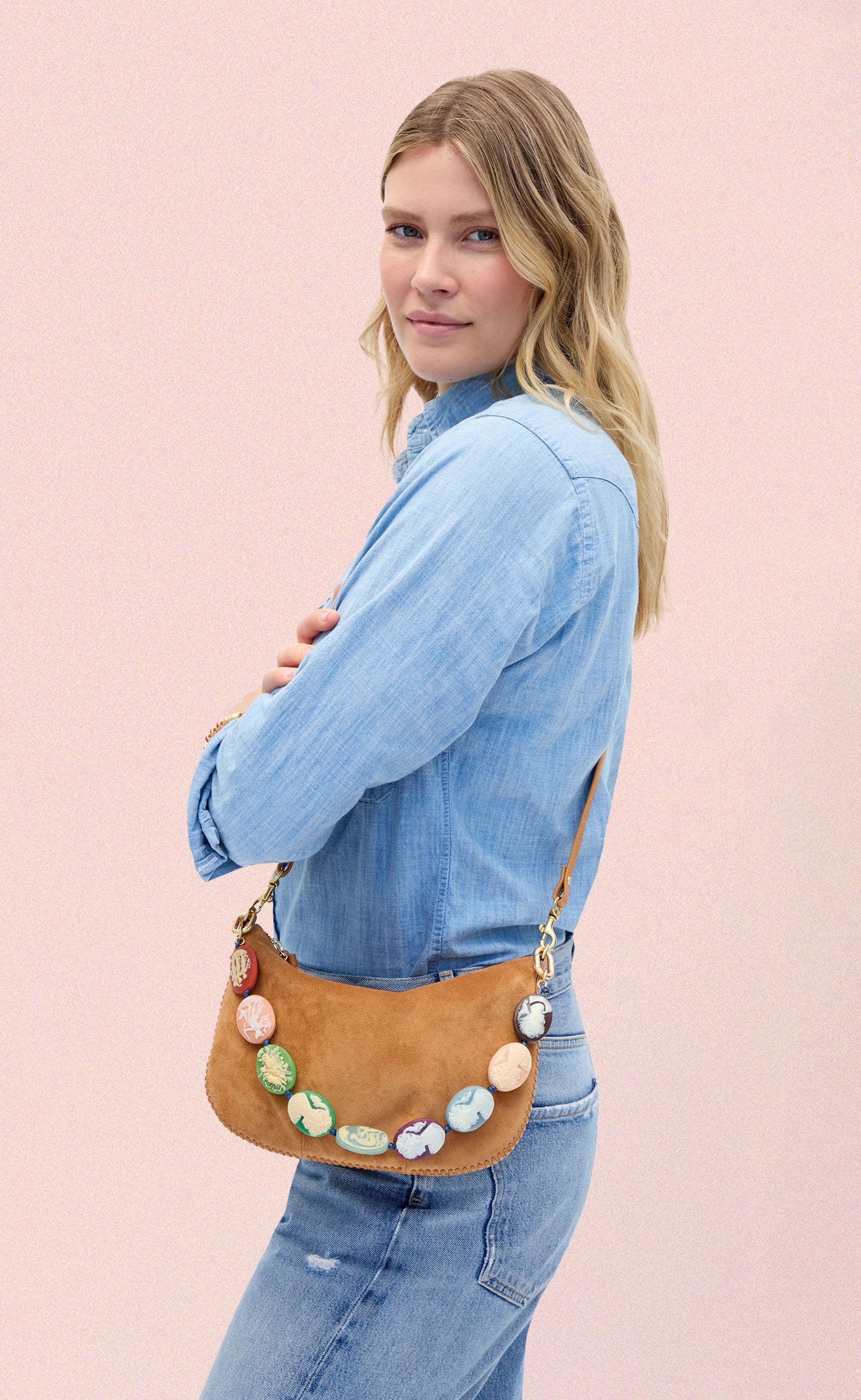 Model carrying the Caramel Suede Petit Moyen with Multi Cameo Shortie Strap. 
