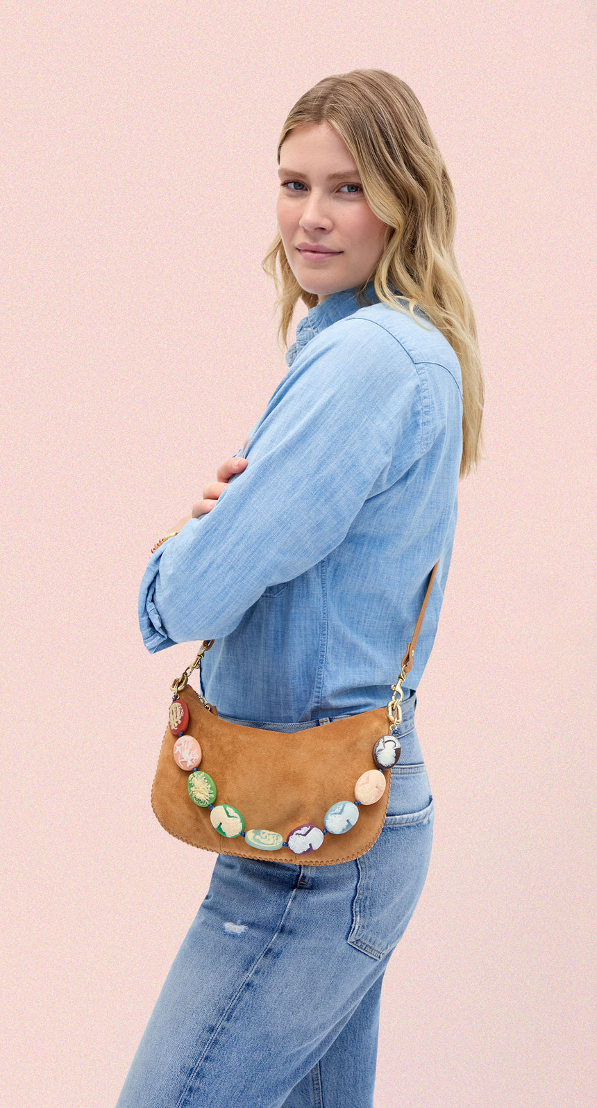 Model carrying the Caramel Suede Petit Moyen with Multi Cameo Shortie Strap. 