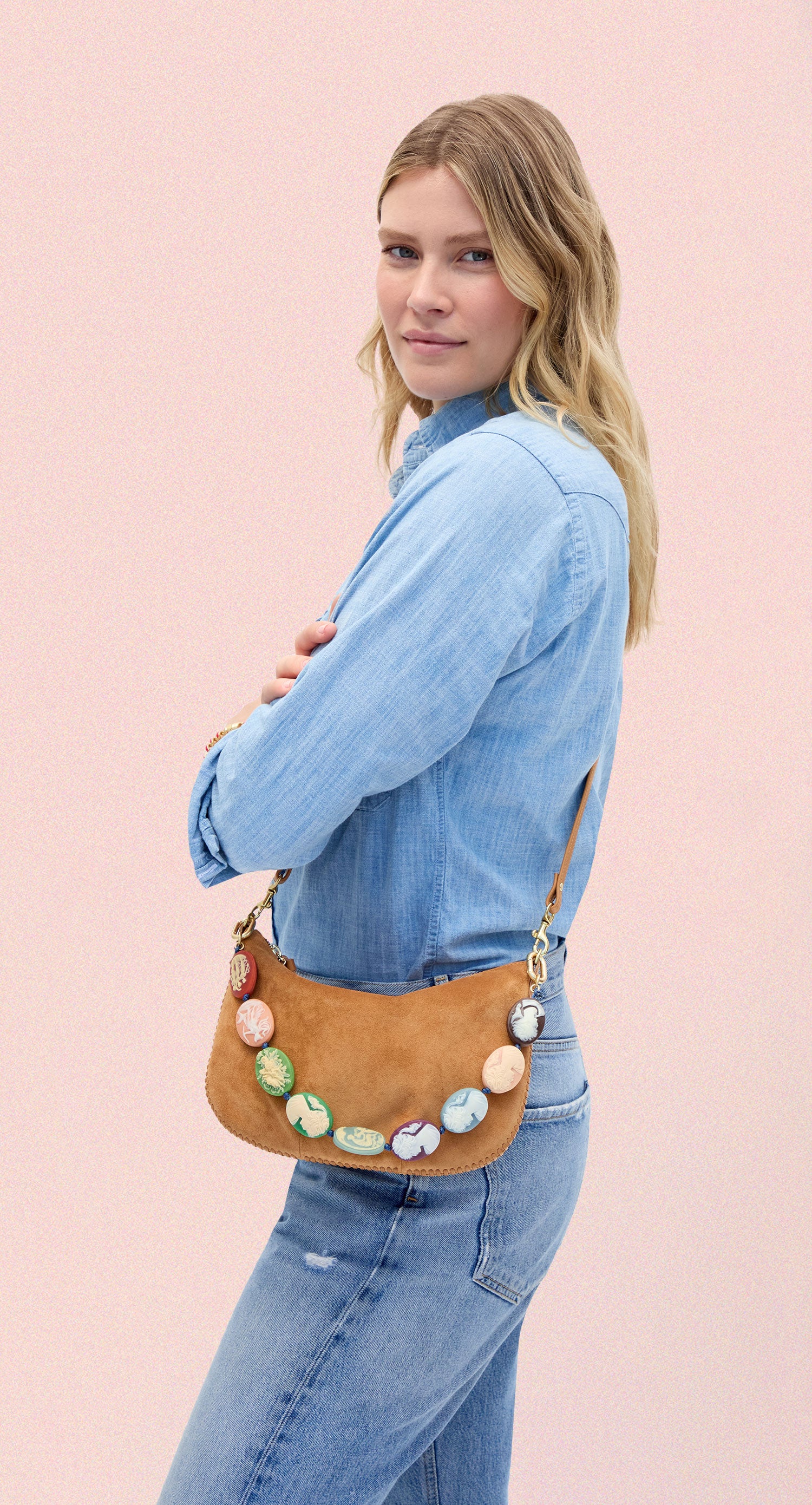 Model carrying the Caramel Suede Petit Moyen with Multi Cameo Shortie Strap. 