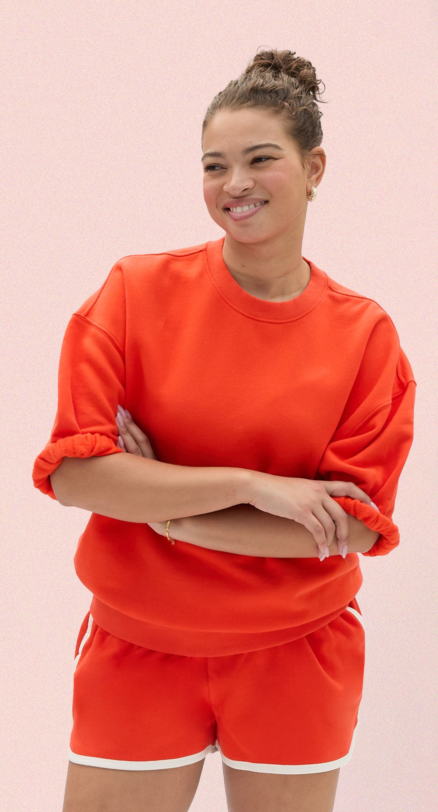 Model wearing the L'Orange Short Sleeve Sweatshirt with matching Le Jogging Shorts. 