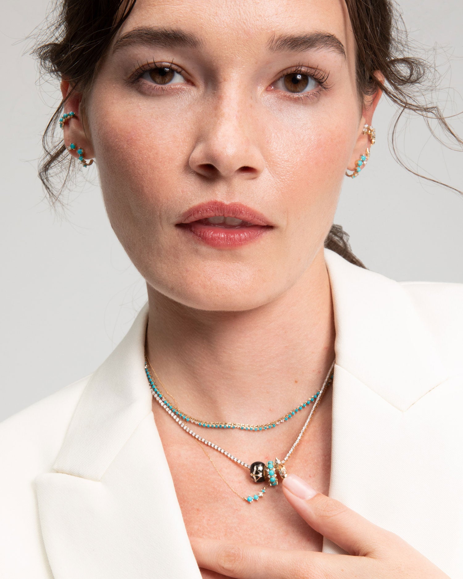 Model Wearing the Adina reyter Graduated Turquoise & Diamond Curve Necklace along with other adina reyter jewelry