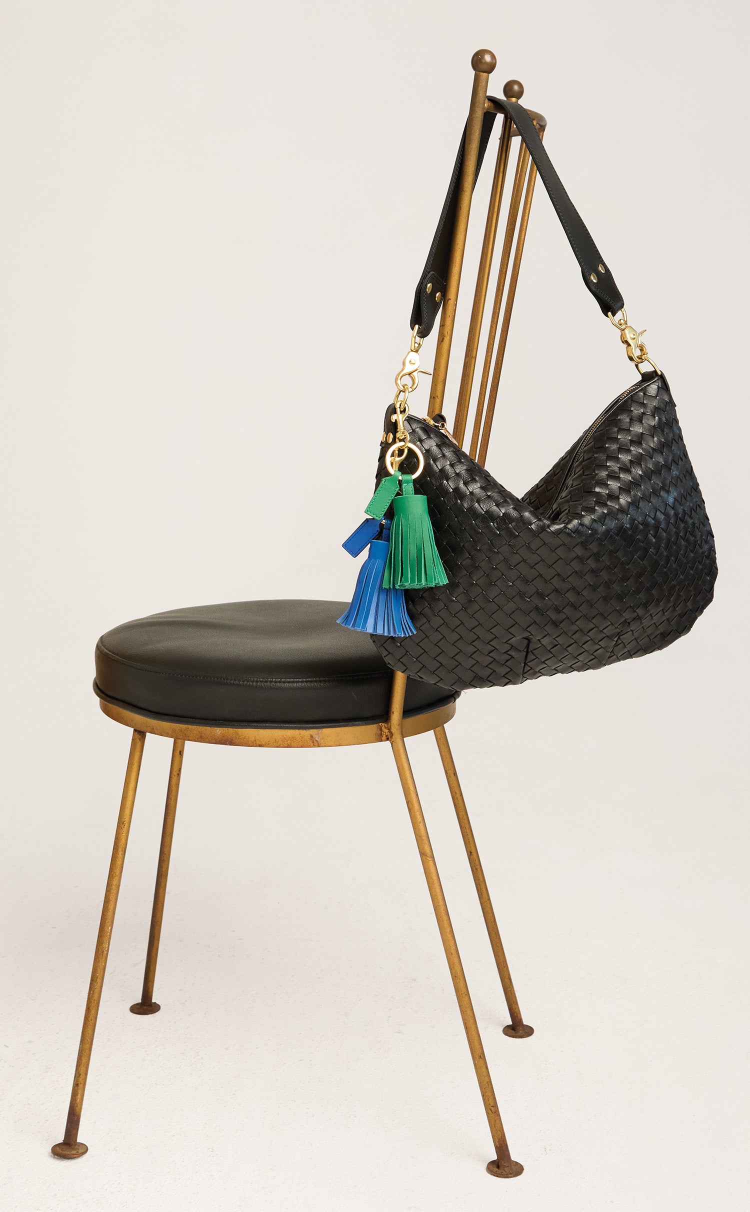 Moyen Messenger with Pom Pom Tassel Keychains.