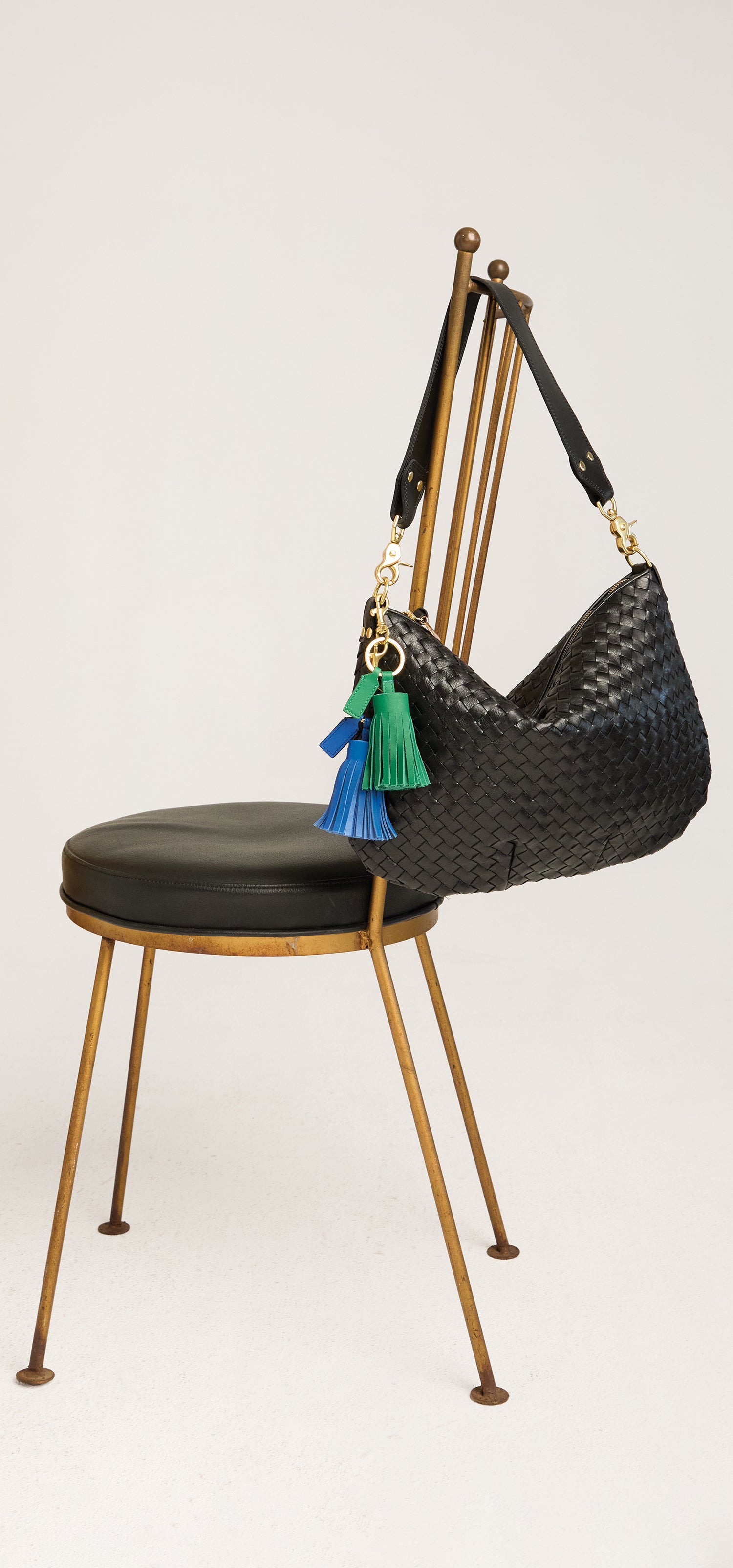 Moyen Messenger with Pom Pom Tassel Keychains.