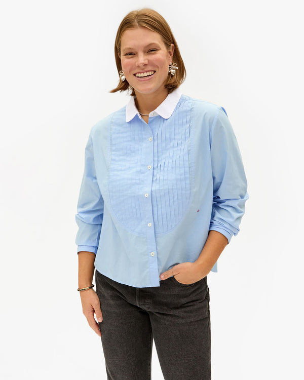 Sonnie wearing the French Blue Anette Tuxedo Shirt with black jeans