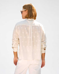 back view of sonnie wearing the Cream Heart Coupé Anette Tuxedo Shirt