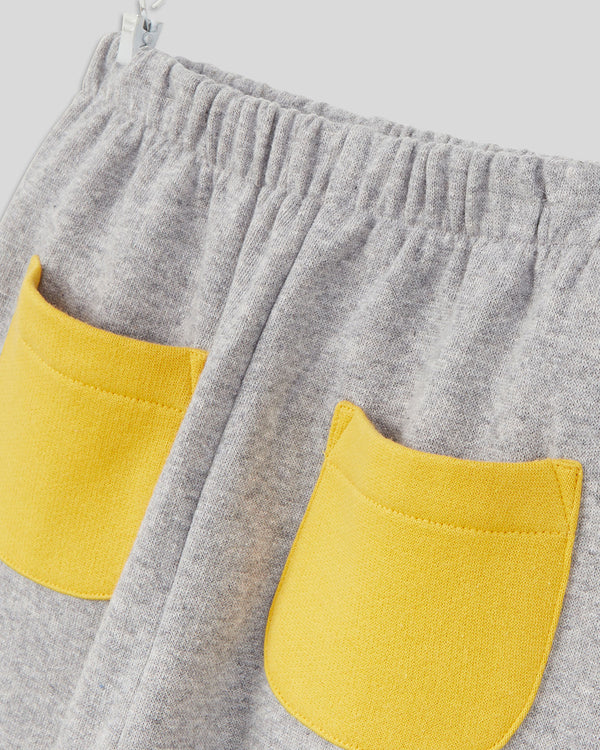 close up of the pockets on the Grey with Marigold Pockets Baby Joggers