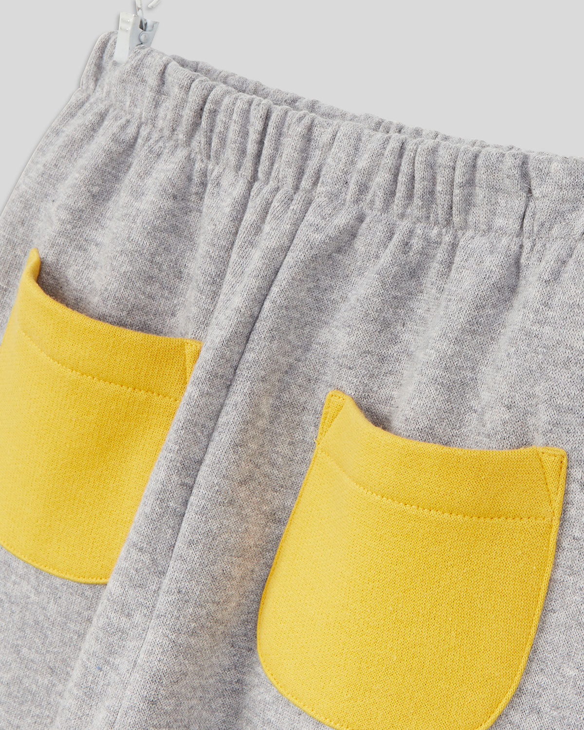close up of the pockets on the Grey with Marigold Pockets Baby Joggers